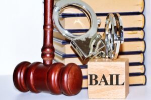 Two blocks that say “bail” next to a gavel and handcuffs. How much is bail for a bench warrant?